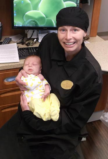 Dr. Billings with our youngest patient (3 weeks old) who received a Frenectomy